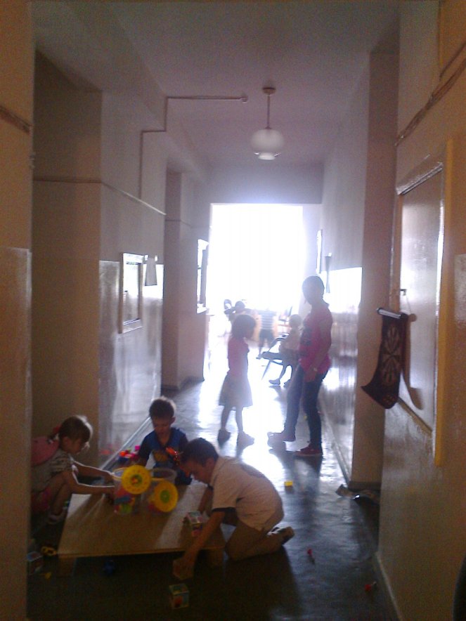 Our children, playing in the hallway playroom.